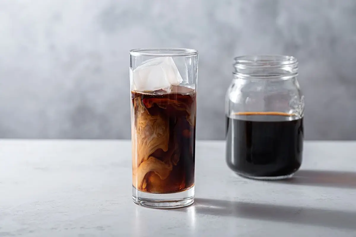 A dark, rich-looking cold brew concentrate in a glass bottle.