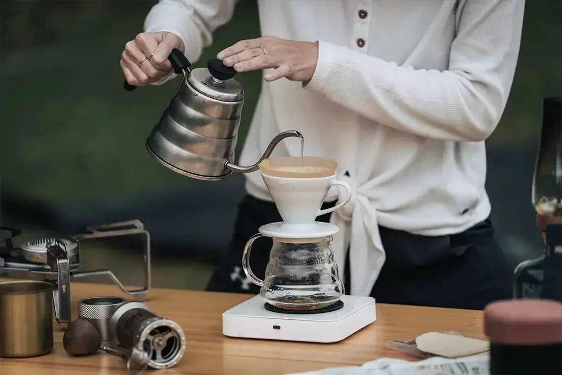 Pour-over coffee being meticulously brewed.