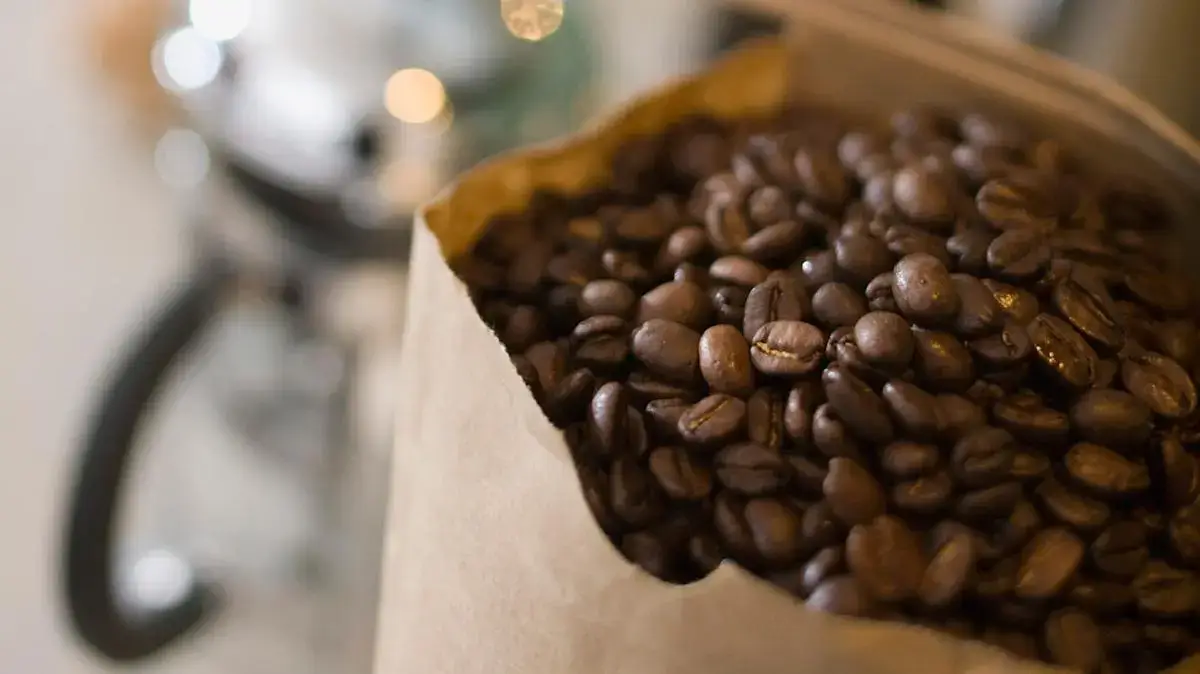 A beautifully packaged bag of Rwanda Inzovu coffee beans.