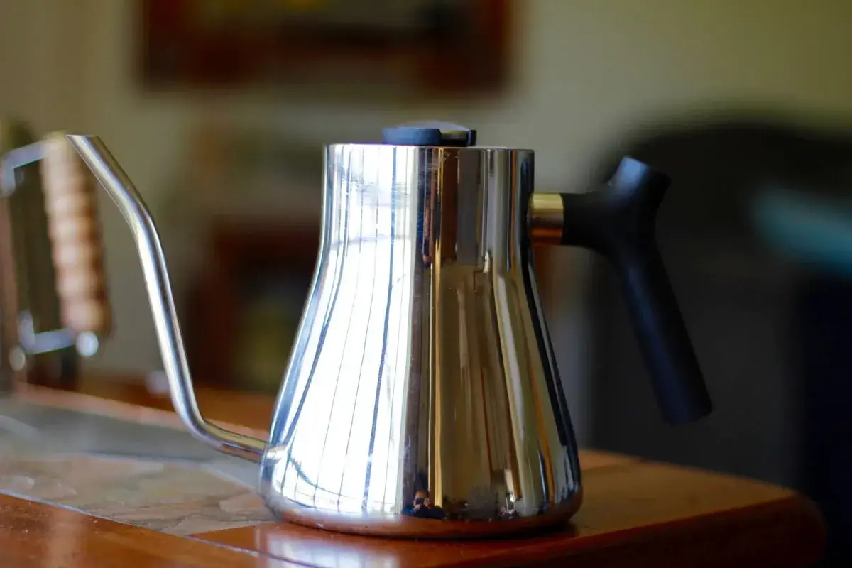 Pour-over coffee being brewed with a gooseneck kettle.
